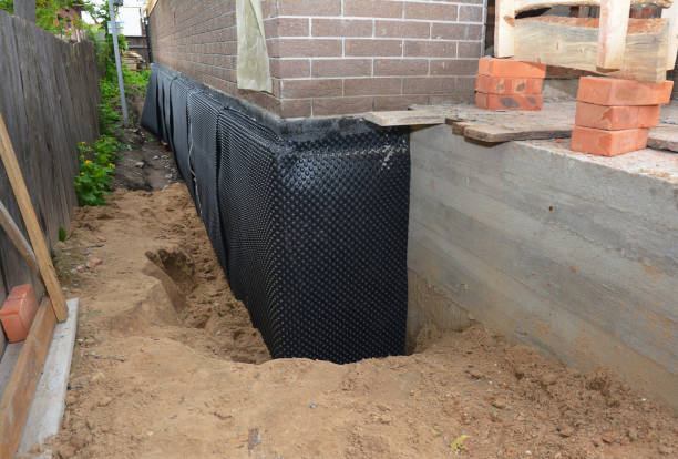Happy homeowners after waterproofing job in Rutherford